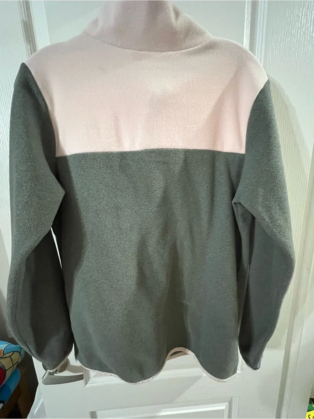 The North Face Girls' Fleece Pullover in grey and pink.